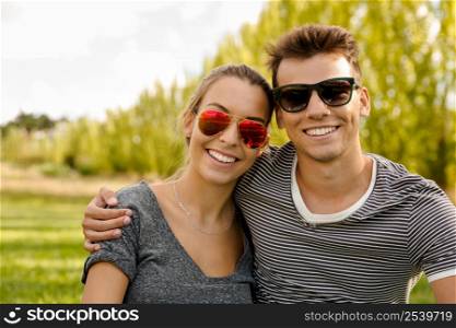Portrait of a happy young couple embraced