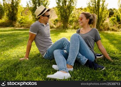 Portrait of a happy young couple enjoying a day in the park together