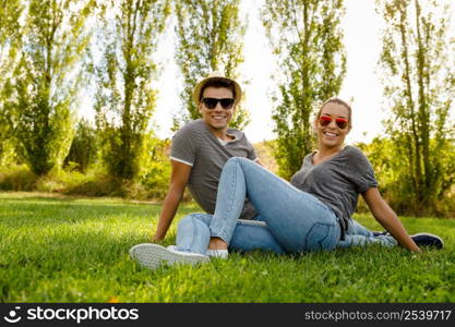 Portrait of a happy young couple enjoying a day in the park together