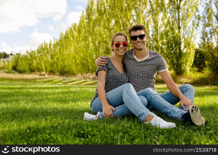 Portrait of a happy young couple enjoying a day in the park together