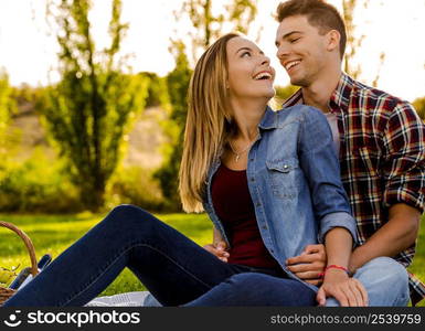 Portrait of a happy young couple enjoying a day in the park together