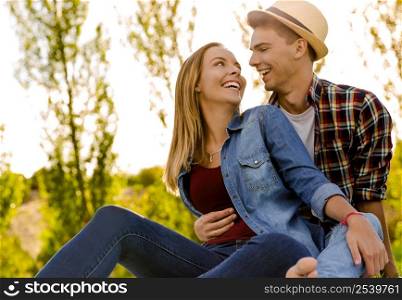 Portrait of a happy young couple enjoying a day in the park together