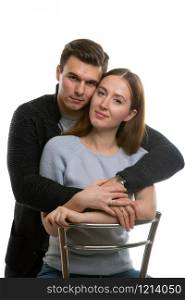 Portrait of a happy young couple on a white background