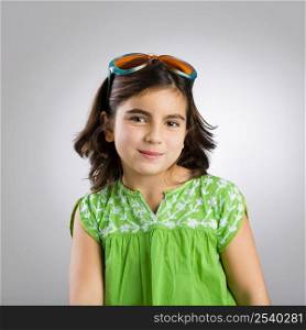 Portrait of a happy young girl wearing funny sunglasses