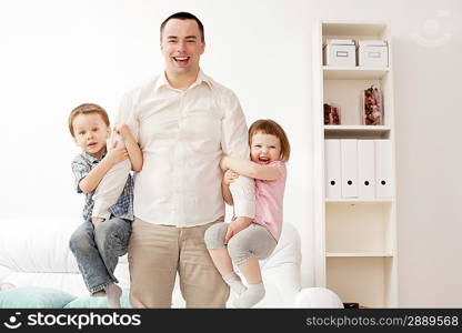 Portrait of a happy young guy with kids