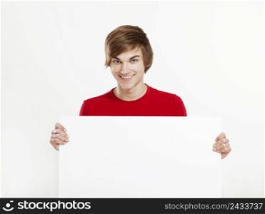 Portrait of a happy young man holding blank white card