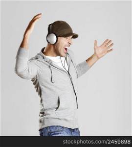 Portrait of a happy young man listen music with headphones