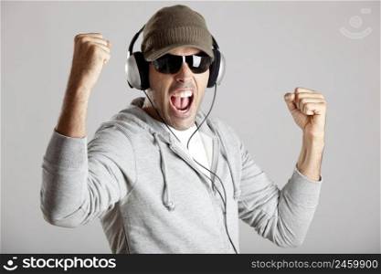 Portrait of a happy young man listen music with headphones