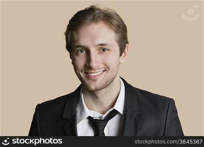 Portrait of a happy young man over colored background