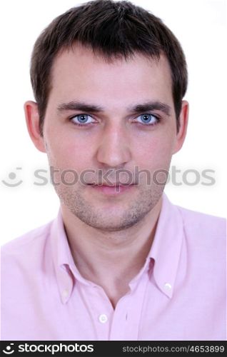 Portrait of a happy young man standing against white background