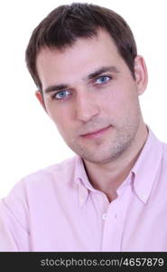 Portrait of a happy young man standing against white background