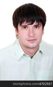 Portrait of a happy young man standing against white background