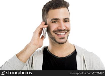 Portrait of a happy young man talking on cell phone isolated on white background