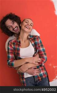 Portrait of a happy young smiling couple in love over color background