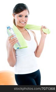 Portrait of a healthy young fitness woman holding bottle of water, isolated on white.