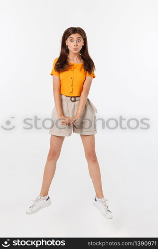 Portrait of a joyful woman jumping in the studio with happy feeling, isolated on white background, 20-28 year old. Portrait of a joyful woman jumping in the studio with happy feeling, isolated on white background, 20-28 year old.