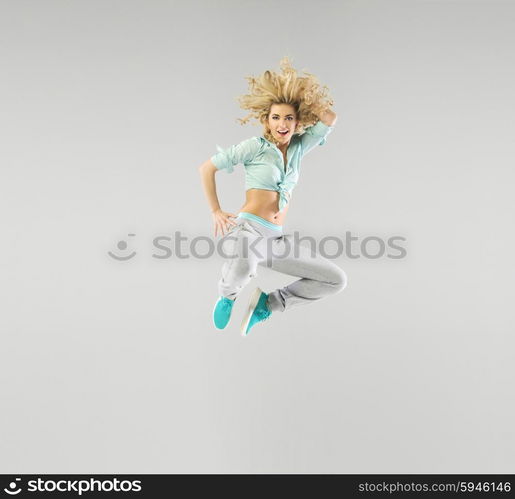 Portrait of a jumping blond woman