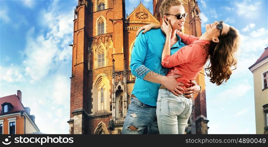 Portrait of a kissing young couple resting in downtown