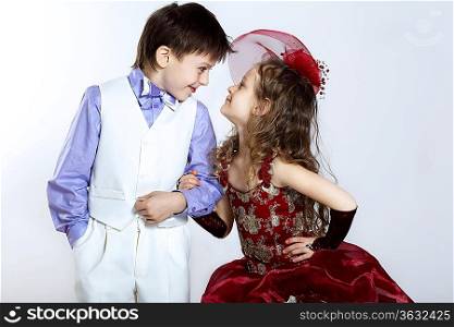 Portrait of a little boy and girl in beautiful dress