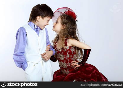 Portrait of a little boy and girl in beautiful dress