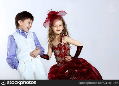 Portrait of a little boy and girl in beautiful dress