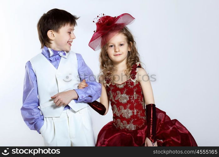 Portrait of a little boy and girl in beautiful dress