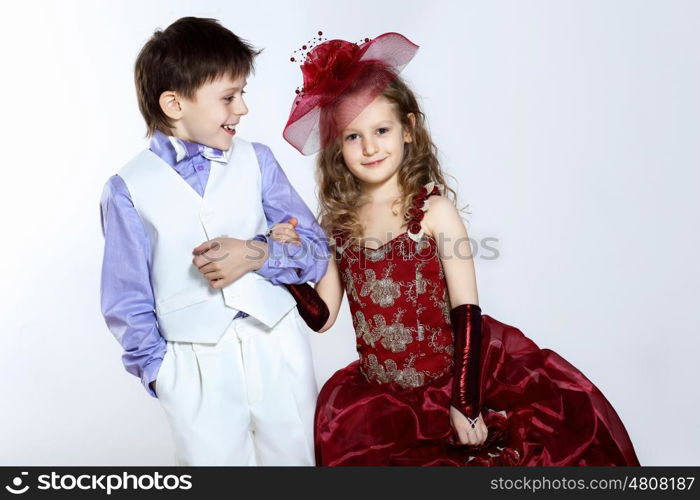 Portrait of a little boy and girl in beautiful dress