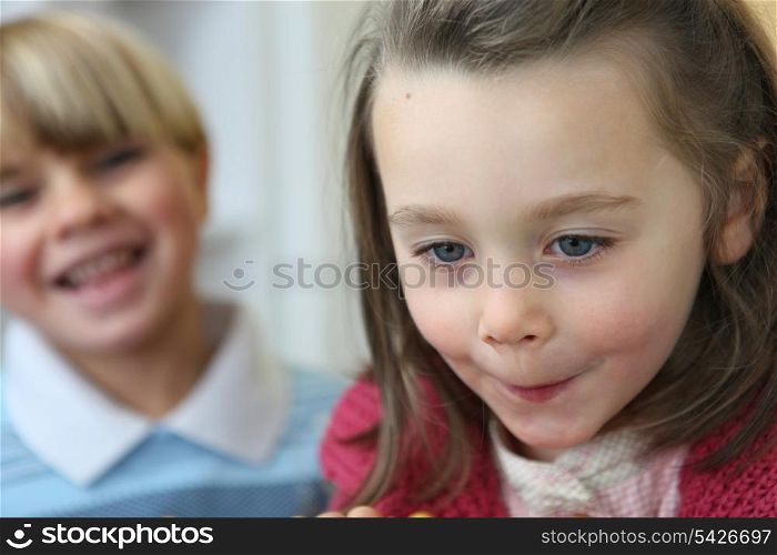 Portrait of a little girl near a little boy
