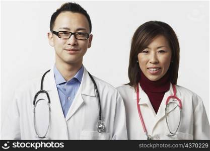 Portrait of a male and a female doctor standing side by side