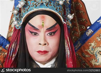 Portrait of a male Chinese opera performer looking serious