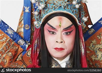 Portrait of a male Chinese opera performer looking serious