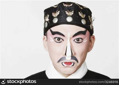 Portrait of a male Chinese opera performer making a face