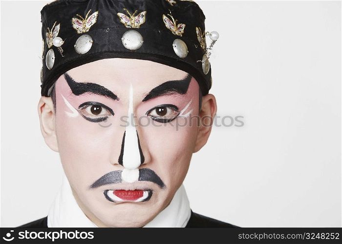 Portrait of a male Chinese opera performer making a face
