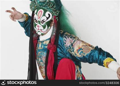 Portrait of a male Chinese opera performer standing on one leg