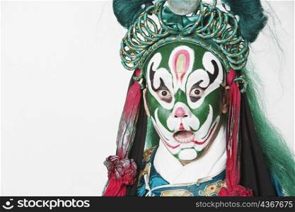 Portrait of a male Chinese opera performer with his mouth open