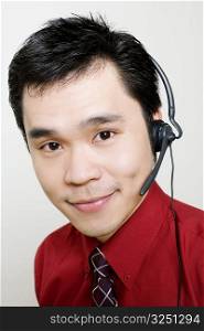 Portrait of a male customer service representative using a headset