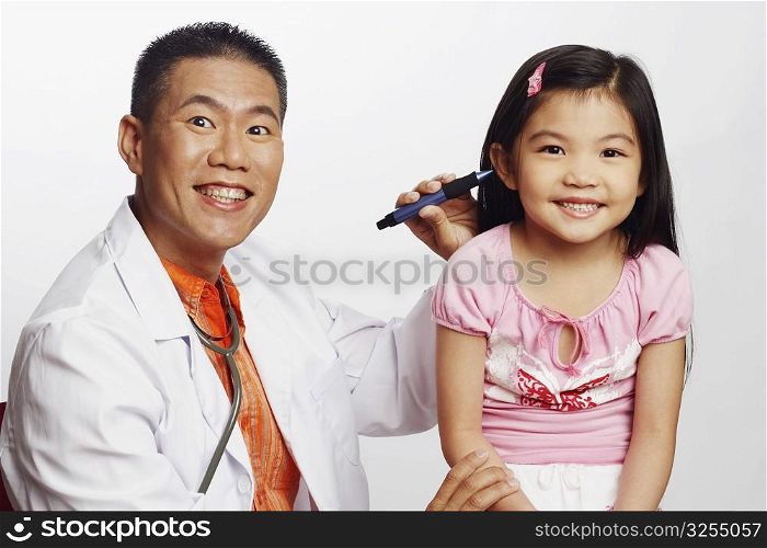 Portrait of a male doctor examining his patient
