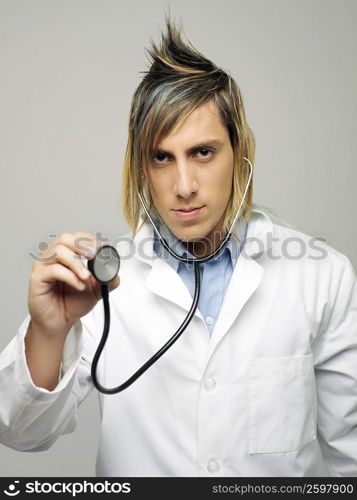 Portrait of a male doctor holding a stethoscope