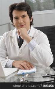 Portrait of a male doctor sitting in a clinic