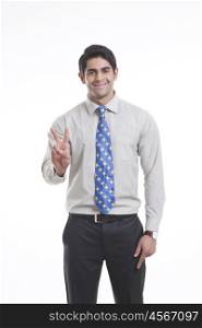 Portrait of a male executive gesturing