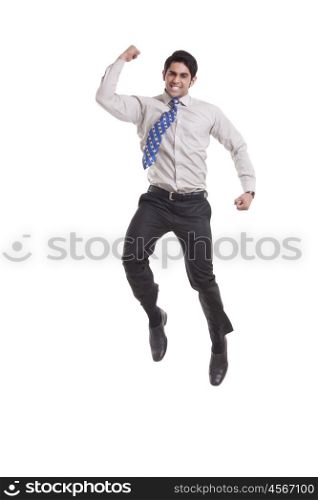 Portrait of a male executive jumping in the air
