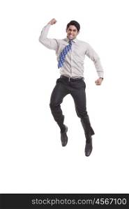 Portrait of a male executive jumping in the air
