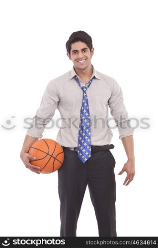 Portrait of a male executive with a basketball
