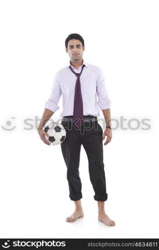 Portrait of a male executive with a football