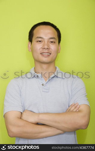 Portrait of a male office worker with his arms crossed and smiling