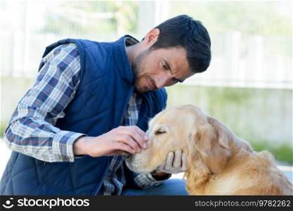 portrait of a male vet with dog