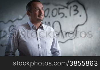 Portrait Of A Man Against The Background Of An Abandoned Building. RAW Video