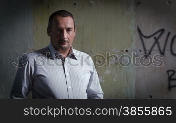Portrait Of A Man Against The Background Of An Abandoned Building. RAW Video