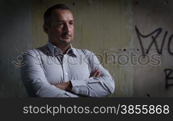 Portrait Of A Man Against The Background Of An Abandoned Building. RAW Video