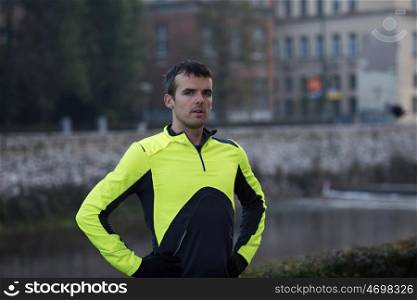 portrait of a man at jogging at cold autumn mornigng